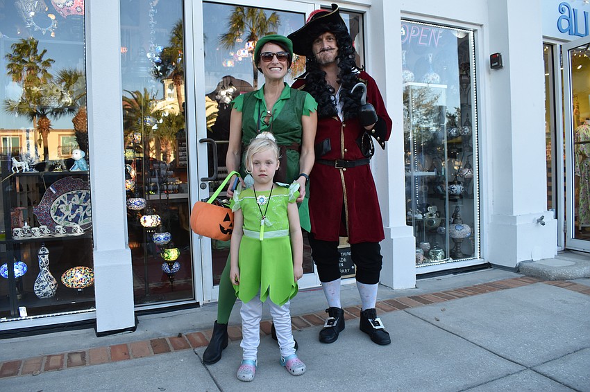 Zoe Leonard, 5, Claire Leonard, and David Leonard dressed as Tinker Bell, Peter Pan, and Captain Hook.