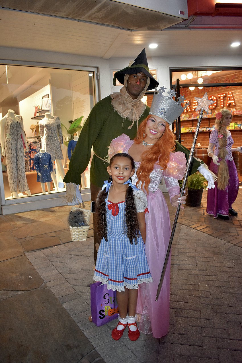 Jerod Ward, Violet Ward, 7 and Tricia Ward dressed as the Scarecrow, Dorothy and Glinda from 