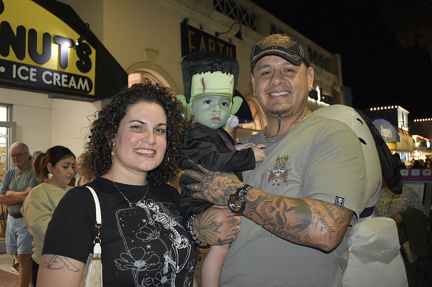 Dianelis Salgado, Johan Reyes, 1, dressed as Frankenstein and Shami Jimenez