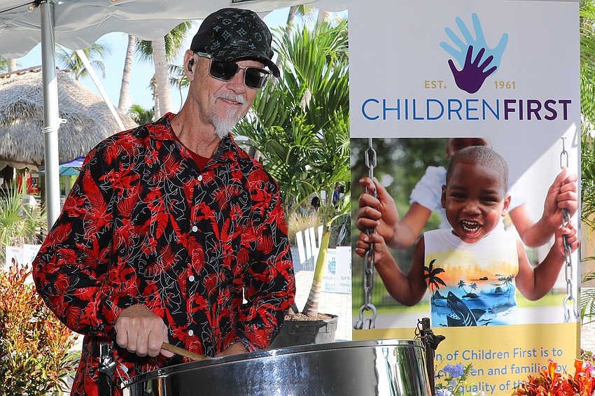 Trinidude Tom of Venice provided Calypso music as guests mingle during the opening hour of Flip Flops & Fashion.