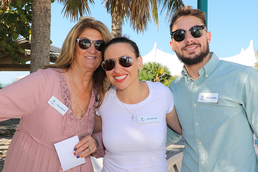 Christine Bolebruch, Dorothy Dugan and Beau Oz volunteer for the event.