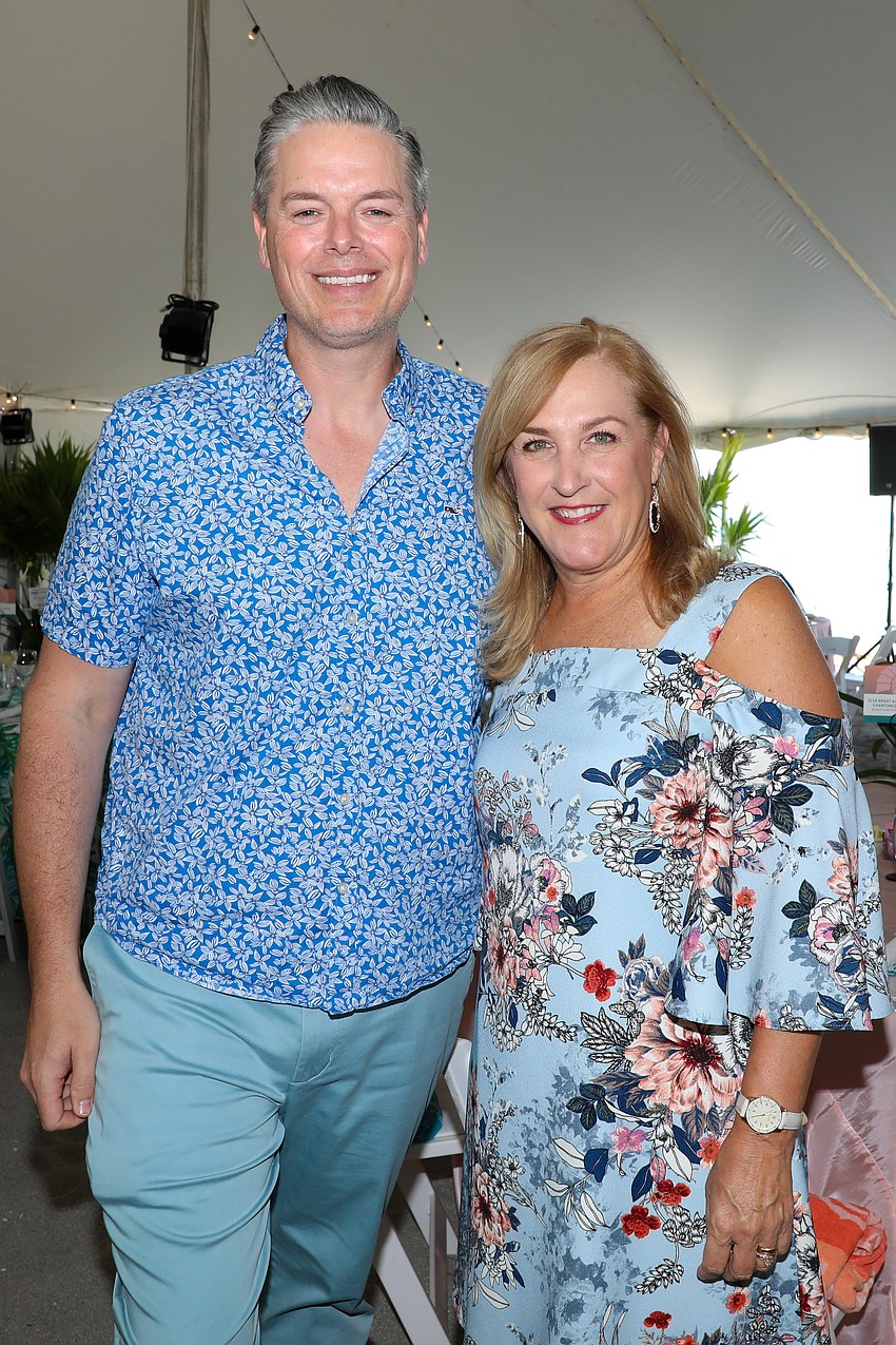 Phillip Lanham and Tracy Knight stop for a photo at the Children First Flip Flops & Fashion event.