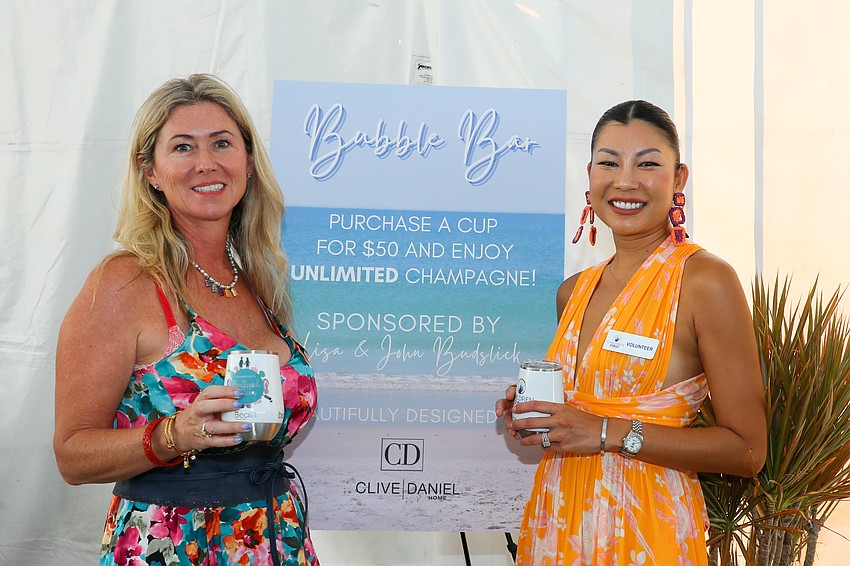 Aurelie Van den Broek and Patra Slomak man the Bubble Bar at the event.