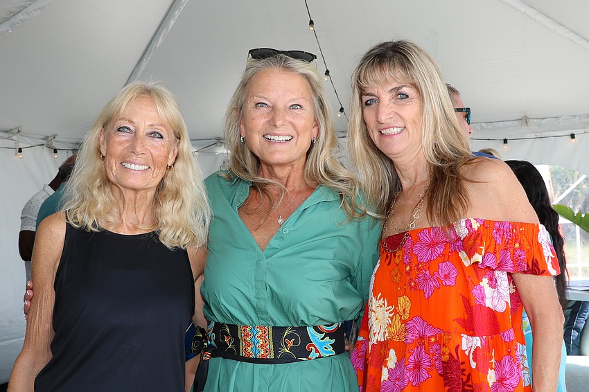 Annabel Serio, center, poses with models Gabi Charity, left, and Silke Weiss.
