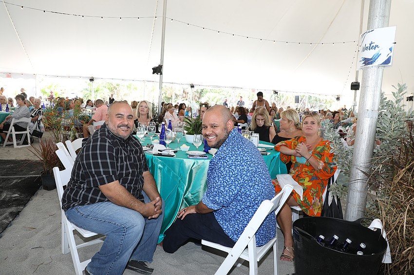 Bealls Inc. employees Steve Maldaonado and Anthony Miller enjoy the show.