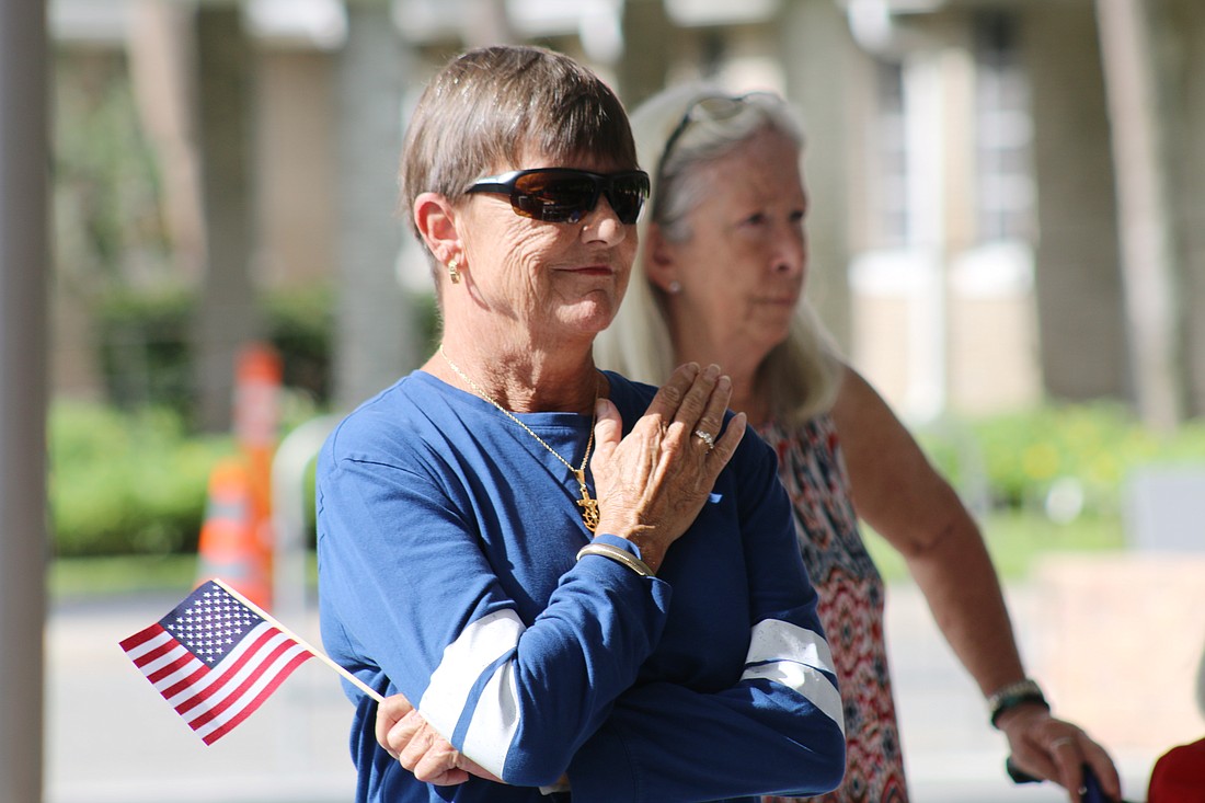 Wynn Hamilton, of Ormond Beach, holds a hand to her heart during OMAM's 2021 Veterans Day Tribute. File photo by Jarleene Almenas
