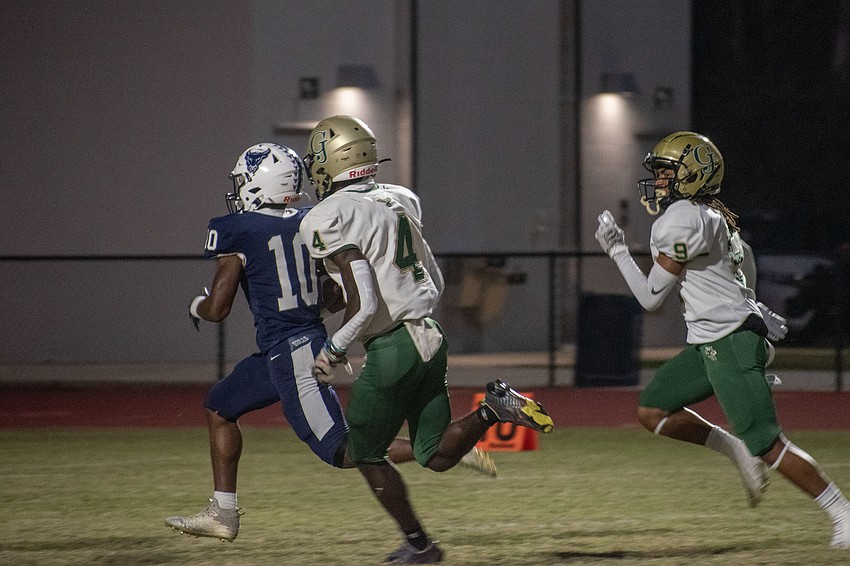 Bulls senior running back Jerone Turner races past the George Jenkins defense for a touchdown on the game's first offensive play.