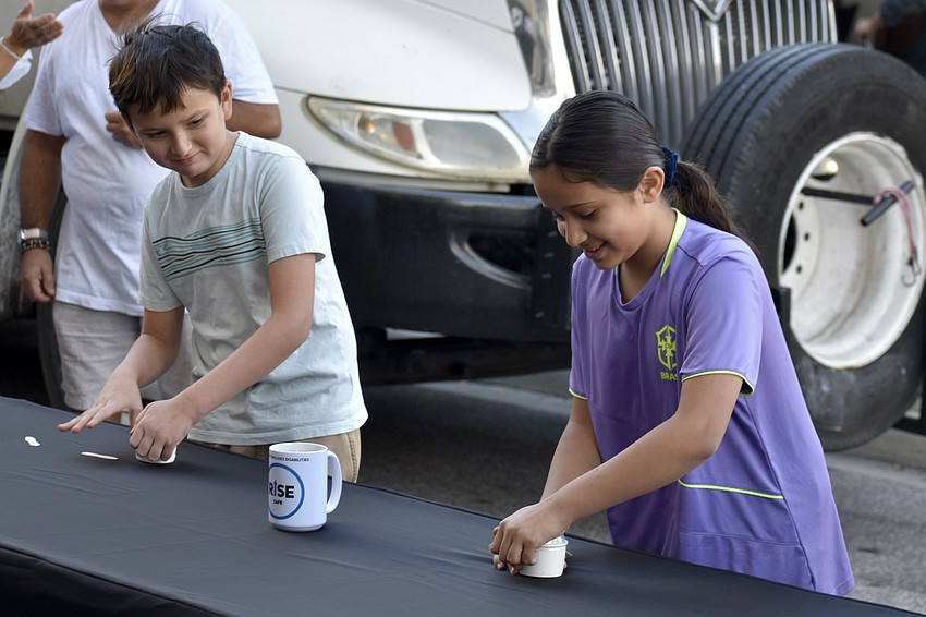 Ivan Gorodnitchev, 10 competed against one other contestant, previous youth champion Leila Schaedler-Luera, 10. Both contestants open their first cups of ice cream.
