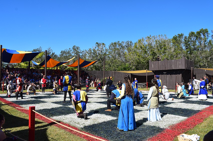 A match of human combat chess is in play at the Sarasota Medieval Fair.