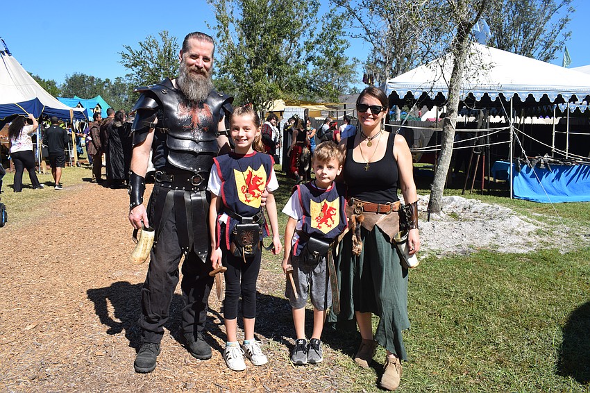 Sarasota's Mark Dietz dresses for the occasion with his 10-year-old daughter Livia Dietz, 8-year-old son Marek Dietz and wife, Erin Dietz. Livia Dietz says she loves the human chess matches at the fair.
