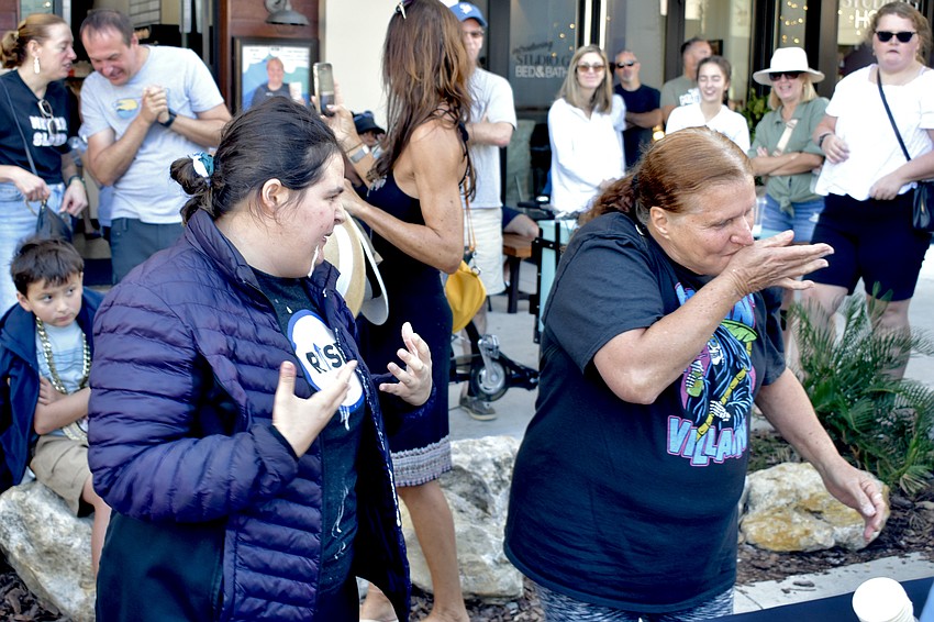 Store employee Ava Bruno and Juanita Christiana finish the competition.