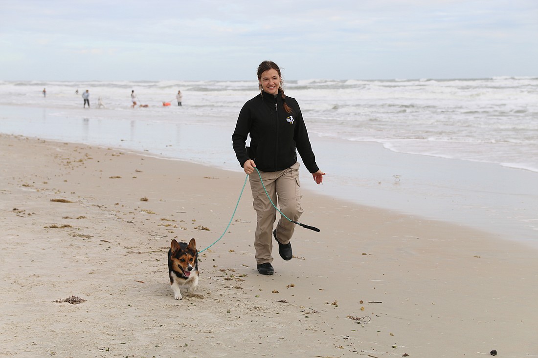 Volusia County Animal Services Director Angela Miedema takes Franny for a walk after the ribbon-cutting ceremony. Photo by Jarleene Almenas