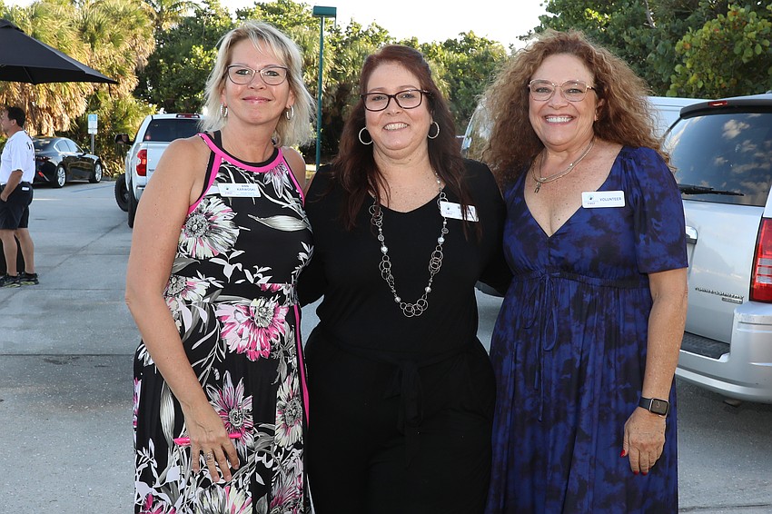 Ann Karwoski, Michelle Bundy and Flora Dynick check in the some 325 guests of the evening.