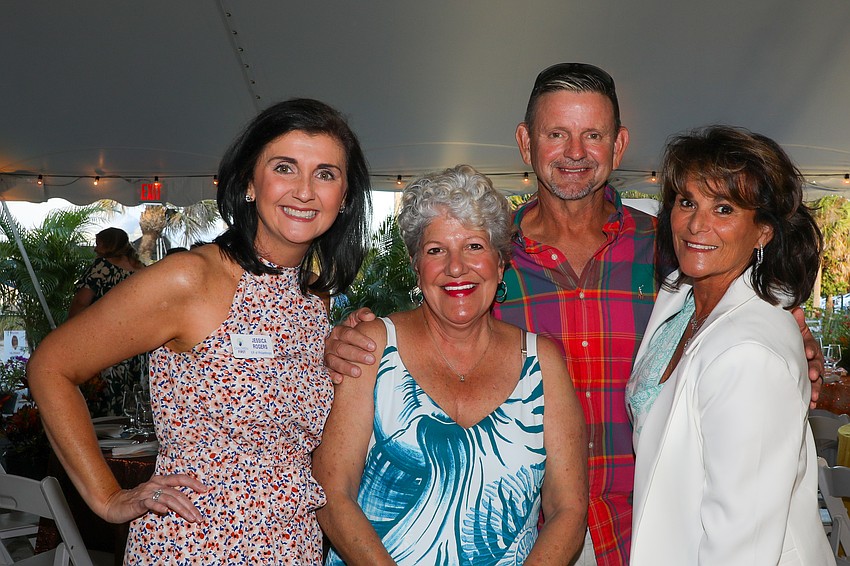 Jessica Rogers, Donna Pachota, David Foster and his wife, Lisa, enjoy the cocktail reception.