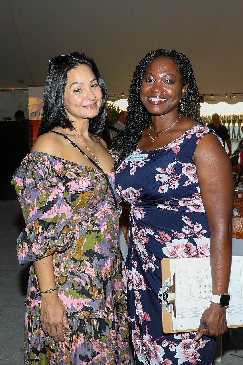 Chase Bank employees Yvonne Harper and Capricia Whiting are part of a team of volunteers who helped make Rockin' Lobster a success tonight.