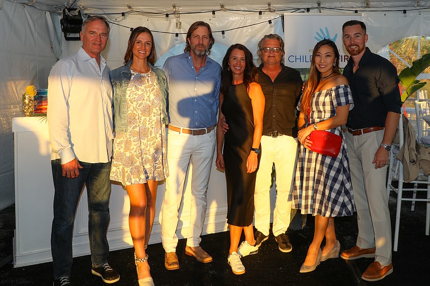 Steve Mort, Merissa and Matt Kihnke, Michelle and David Young, Jules Ha and Kory Lee are headed into the main tent for a lobster dinner prepared by Sharky's and Finn's chefs.