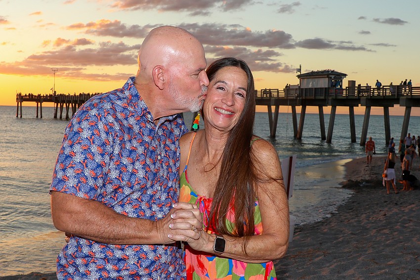 David Pilkington gives his wife, Carol, a quick kiss to while celebrating the gorgeous sunset.