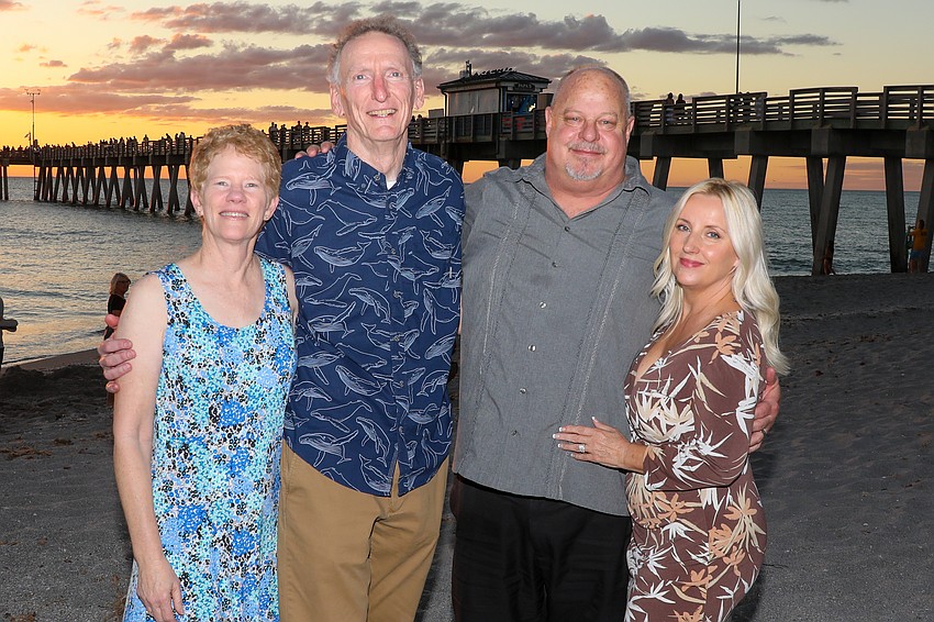 Cheryl and Mark Reina and Michael and Dawn Baers are having a lot of fun near the pier at Sharkys in Venice, Florida.