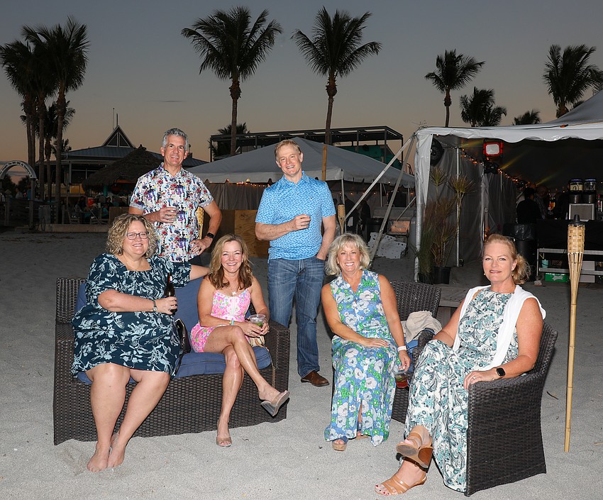Karyn and Dave Cravens, Caryn and Steve-O Patterson, Kim Schuerman and Cathy Brown are enjoying new and old friendships on the beach at Rockin' Lobster.
