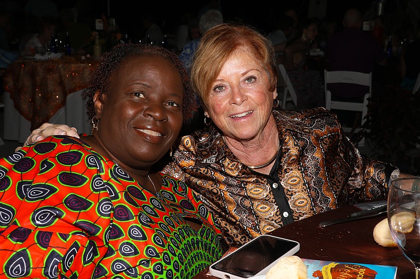 Kathleen Louis and Linda Parchen enjoy salad before the lobsters make their debut.