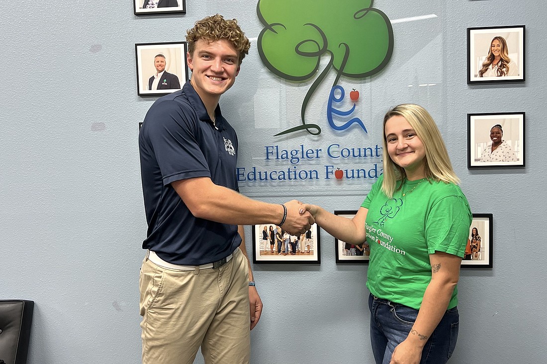 The To-Do Dudes CEO Erik Libby with Flagler County Education Foundation Assistant Director of Marketing and Communications Stephanie Ellis. Courtesy photo