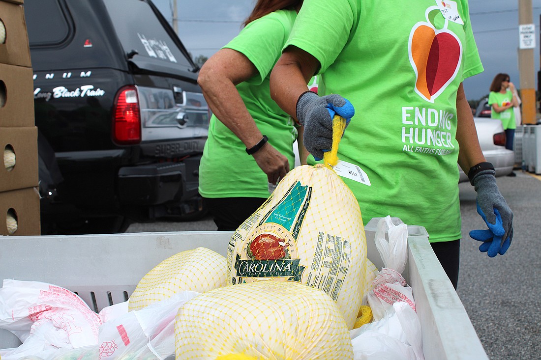All Faiths Food Bank expects to distribute 13,000 frozen turkeys and sides for Thanksgiving.