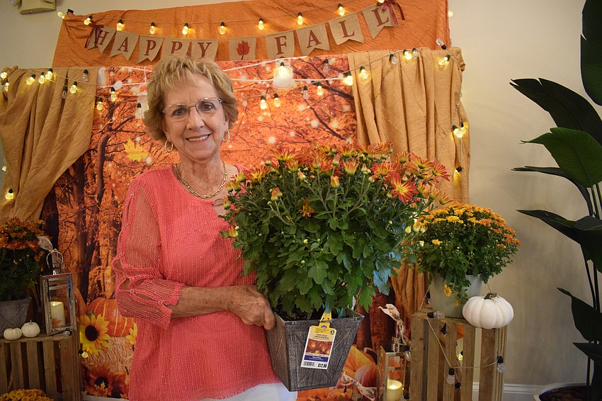 Tara's Joyce Humberston claims the flowers she won. 