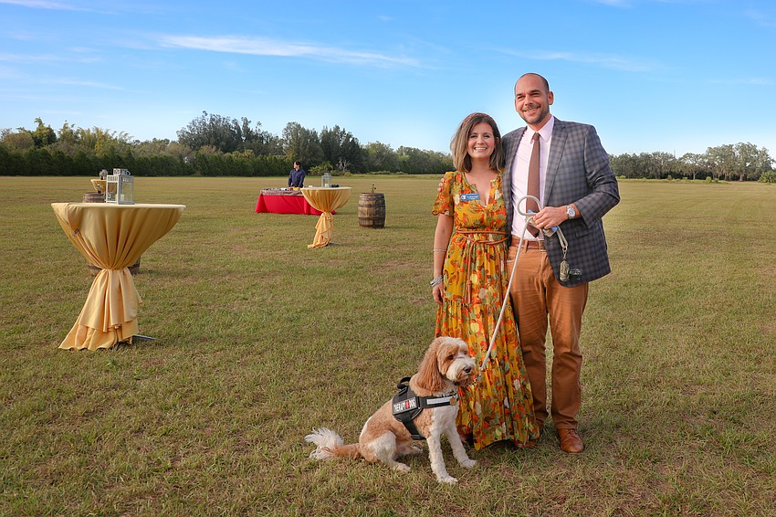 Resilient Retreat founder Sidney Turner with husband, Troy, and their therapy dog, 4-year old Journey