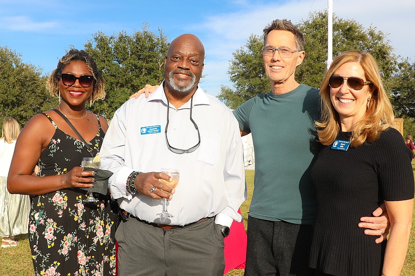 Kashae Foster and her dad, Chaplain Kelvin Foster, catch up with  Steve Ellis and board member Sherri Mills.