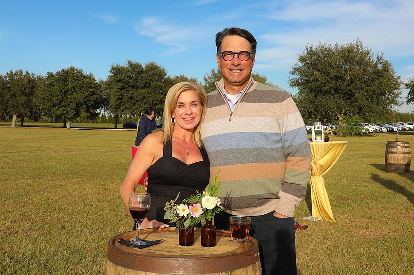 Amee and Rich Petitt during the cocktail hour, which was held in an open field.