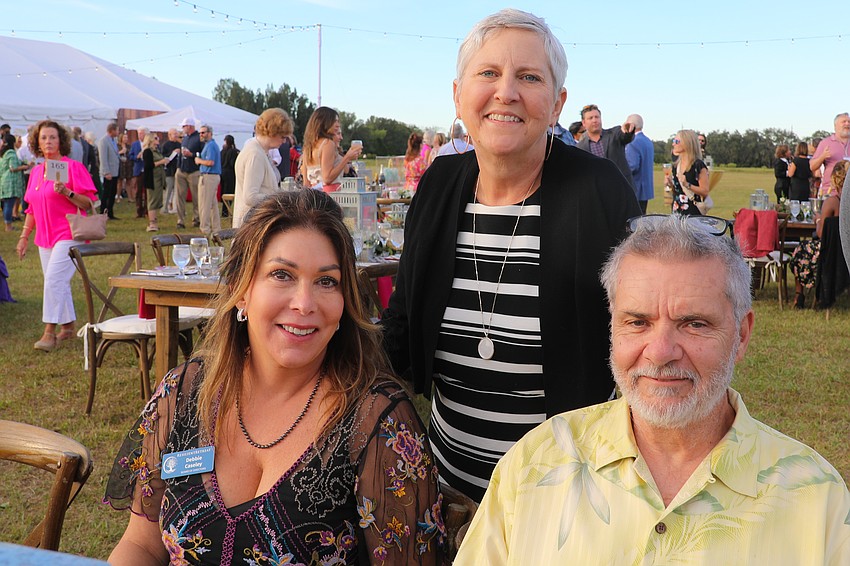 Board member Debbie Casely, Laura Towle and Craig Wetter