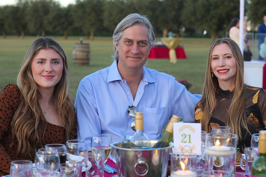 Greg Campbell from Pier 22 enjoys dinner with his daughter, Morgan, and wife, Karissa.