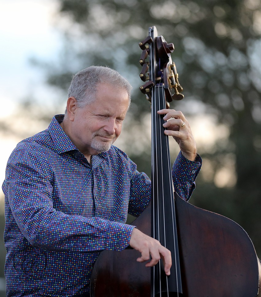 Providing a subtle rhythmic pulse is well known acoustic bassist Michael Ross.