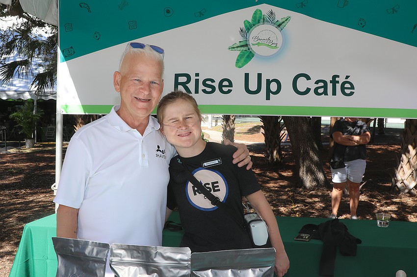 Don Herndon serves coffee with Rise up Cafe's Manning Reade.
