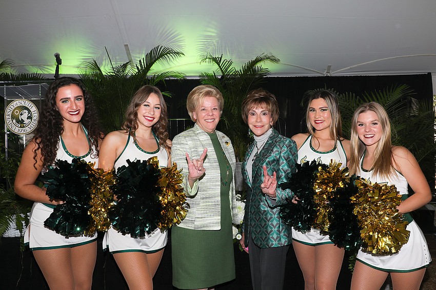 USF President Rhea Law and USF past President Judy Genshaft with the USF Sun Dolls Sasha Musumeci, Christina Glaze, Alysia Haun and Maddie Jones.