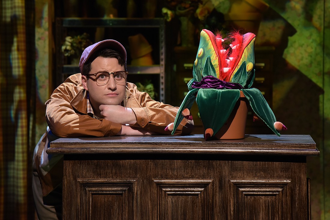 Sam Seferian as Seymour with Audrey II in FST's "Little Shop of Horrors."