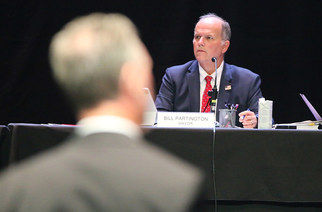 Mayor Bill Partington listens as Rob Merrell, the attorney representing the developers of Tomoka Reserve, presents during the City Commission meeting on Tuesday, Nov. 8. Photo by Jarleene Almenas