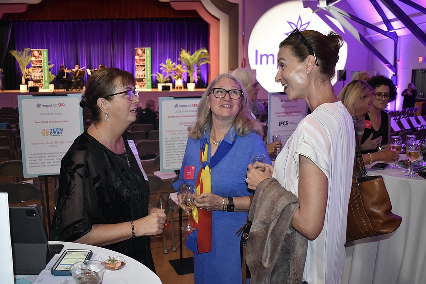 Kay Stump, Nancy Rehkamp and Eva Treffert talk.