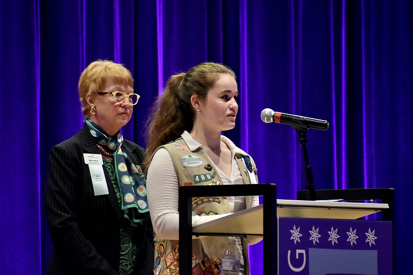 Mary Anne Servian, CEO of Girl Scouts of Gulfcoast Florida, and Kenzie Shockey, 15, offer a presentation.