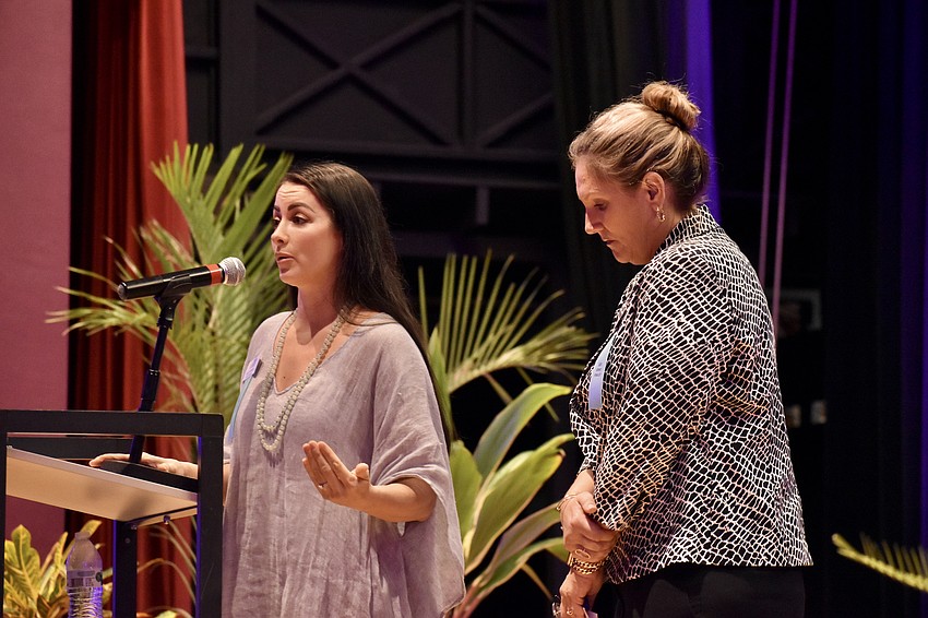 Katy McBrayer-Lynch, president of Sarasota Teen Court, tells the story of how the organization changed her life during a presentation she offered with the organization's CEO Heather Todd.