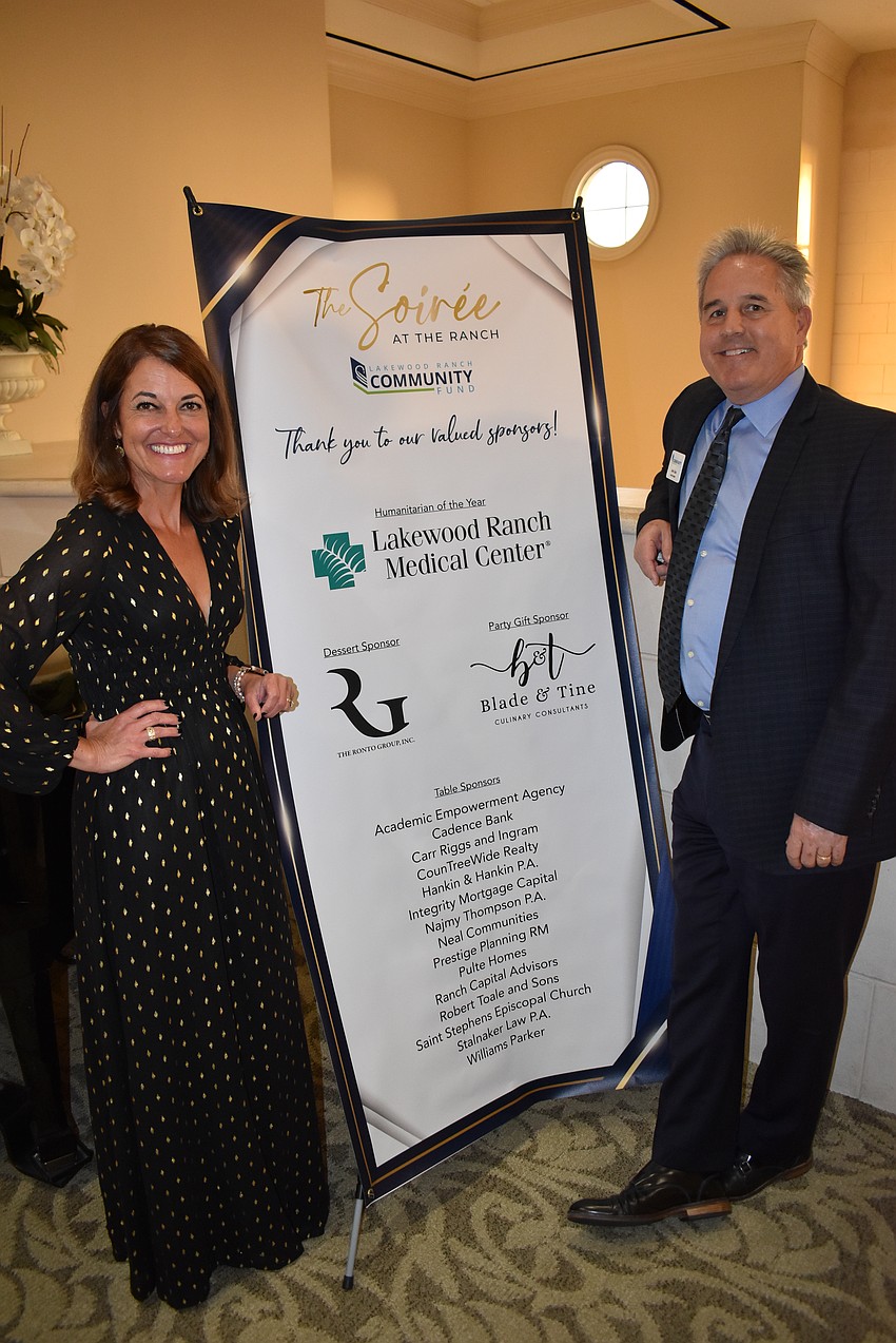 Nicole Ryskamp, former president of the board of the Lakewood Ranch Community Fund, and Mark Clark, the current president, get ready to meet the guests at the Soirée at the Ranch.
