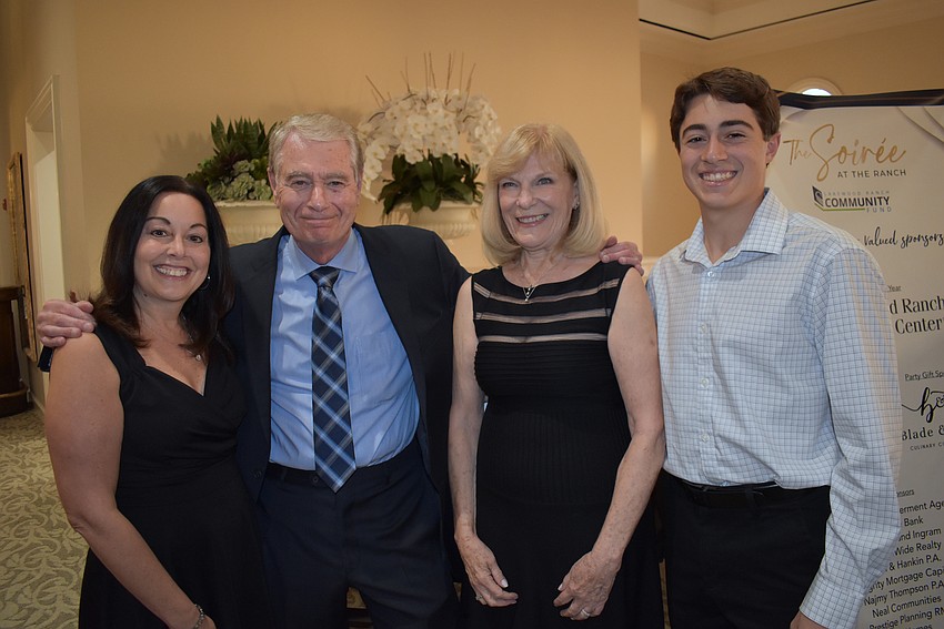 Ted Lindenberg (second from left) celebrates his 2023 C. John A. Clarke Humanitarian Award with his daughter, Michele Olson, wife Susan, and grandson Ryan Olson.