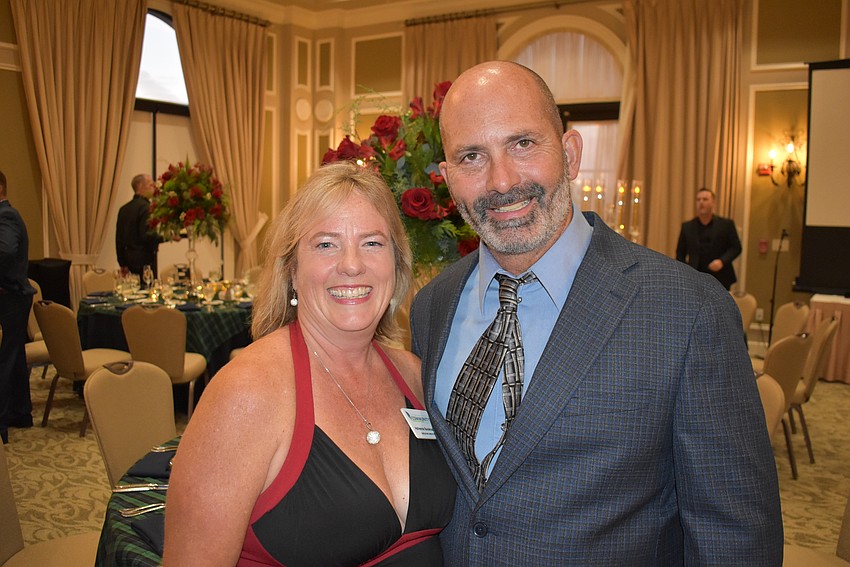 Adrienne Bookhamer, the executive director of the Lakewood Ranch Community Fund gets a brief moment away from organizing the event to visit with her husband, Doug Bookhamer.