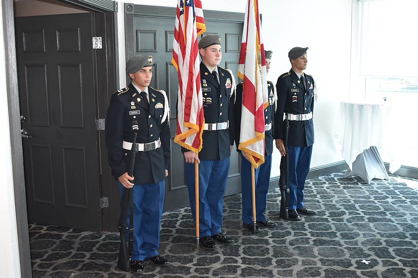 Keller Button, Colton Fixter, Ethan Hylwa and Tristan Constable of the honor guard prepare to offer their