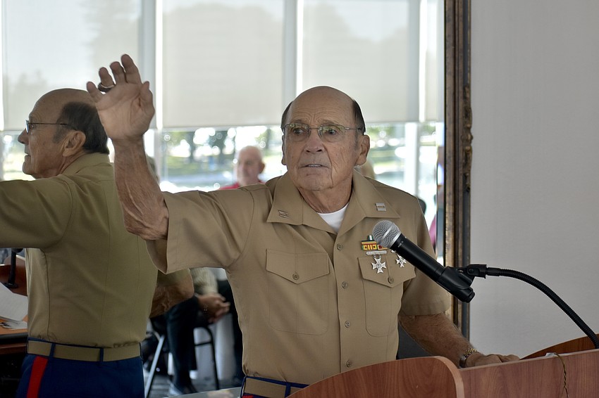 Tom Smith makes an announcement, calling on attendees in specific categories to stand.