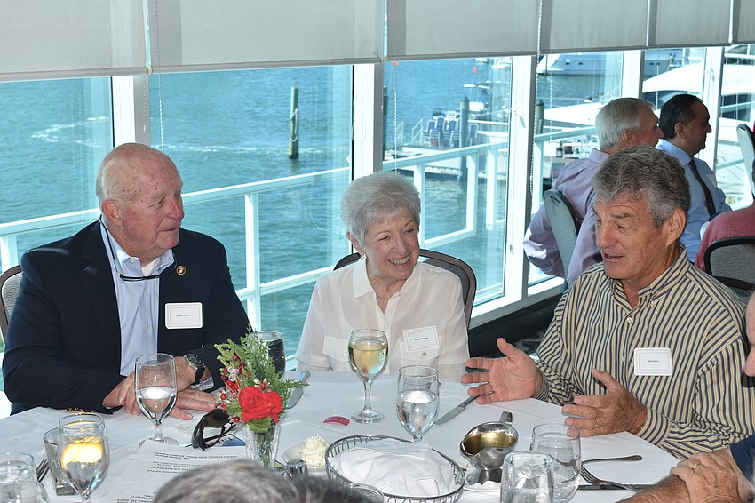 Stewart and Monica Regnier, and Mark Davis enjoy a conversation.