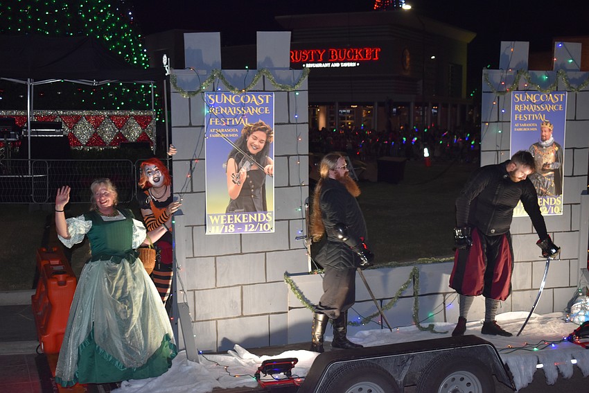 The Suncoast Renaissance Festival float featured a sword fight.