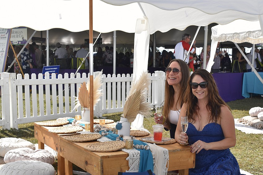 Alison Cossetti Clough and Allison Boccaccio are seated in the VIP area.