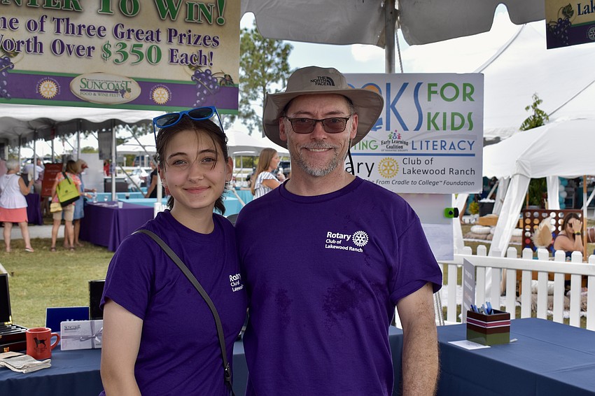Skylar and Eric Leichter volunteer selling raffle tickets. The grand prize includes gift certificates from every participating restaurant.