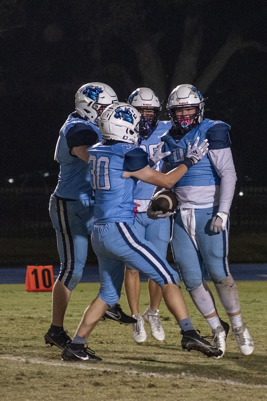 ODA sophomore Heath DeRusso (9) celebrates with teammates after recovering an LPCA fumble.